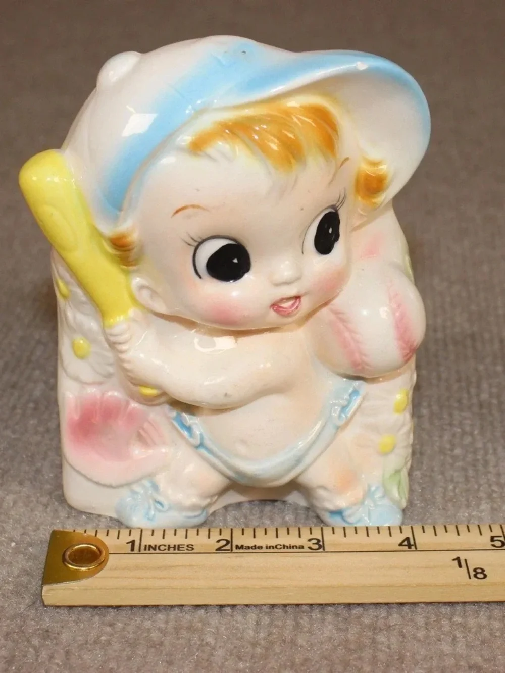 Vintage Ceramic Baby Figurine with Pastel Blue and Yellow Accents